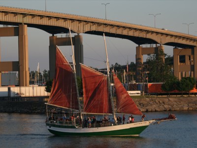 Spirit of Buffalo sailing under a bridge