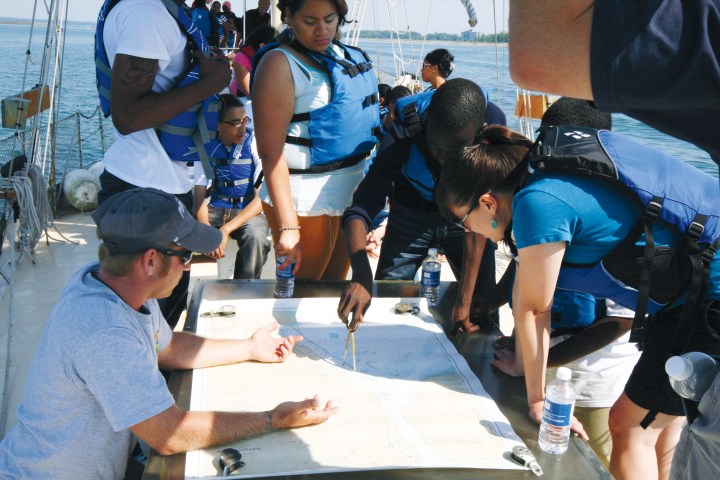 Students learning about maps on a field trip