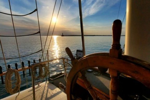 a wooden boat in a body of water